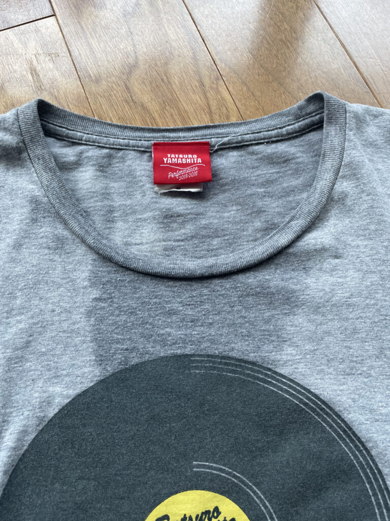 A gray T-shirt soaked with sweat.