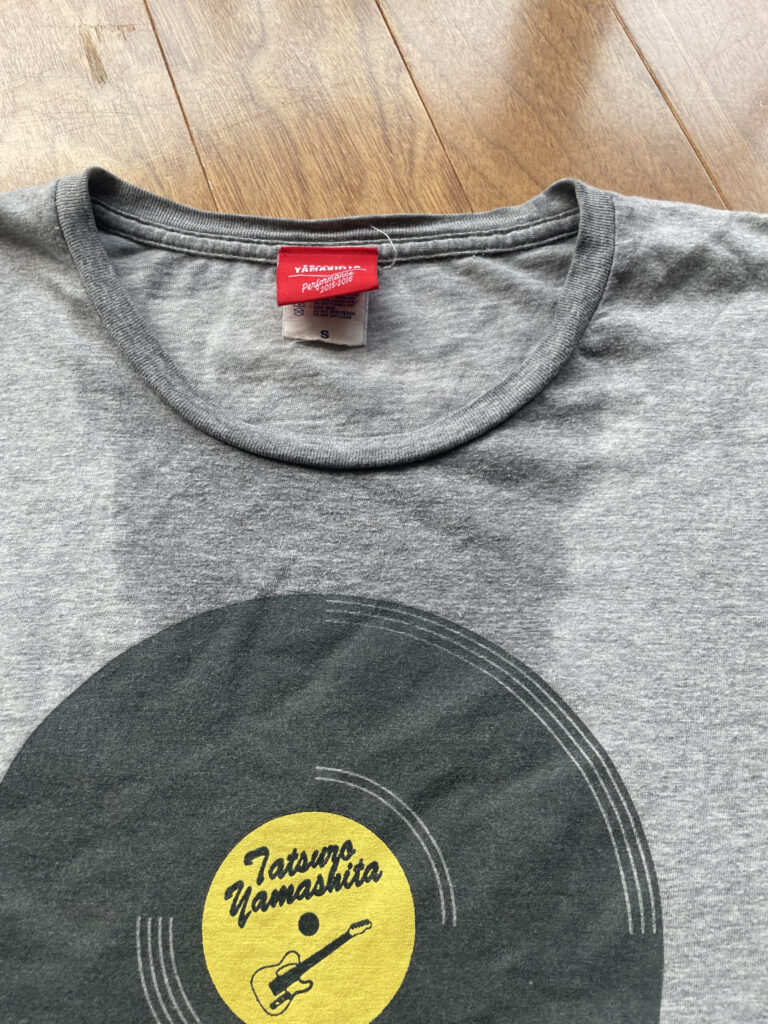 A gray T-shirt soaked with sweat.