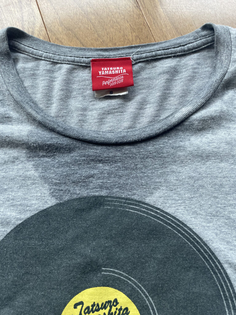 A gray T-shirt soaked with sweat.